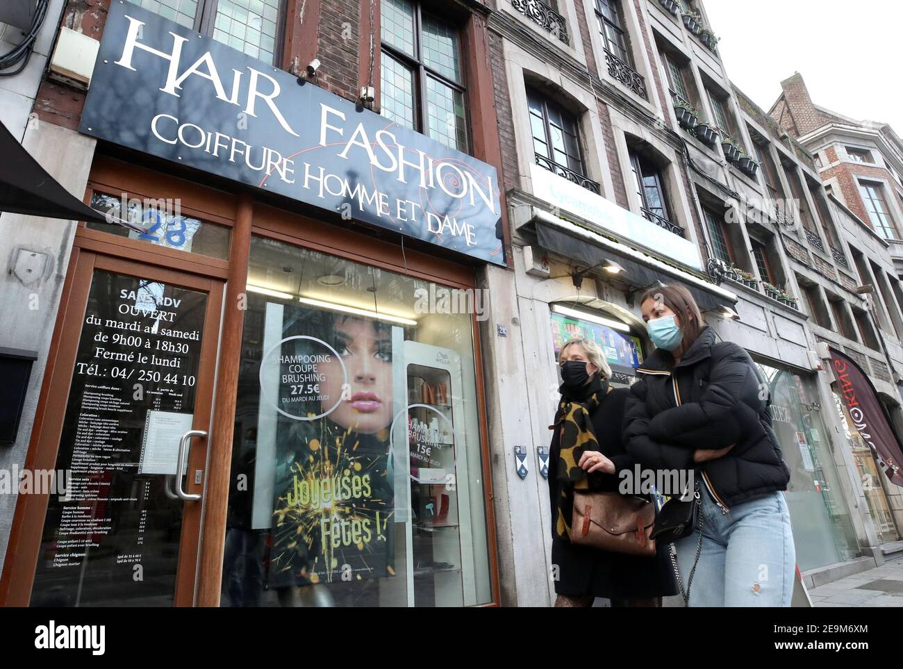 People Walk Past A Closed Hairdressing Salon Amid The Outbreak Of The Coronavirus Disease Covid 19 In Liege Belgium February 5 2021 Reuters Yves Herman Stock Photo Alamy