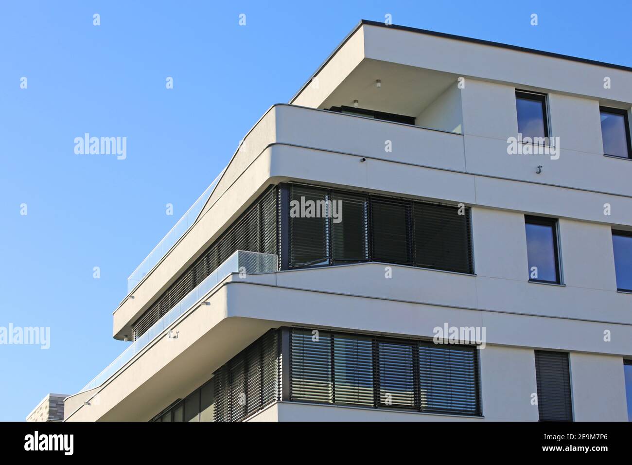 Image showcasing Modern apartment building in urban style Stock Photo - Alamy