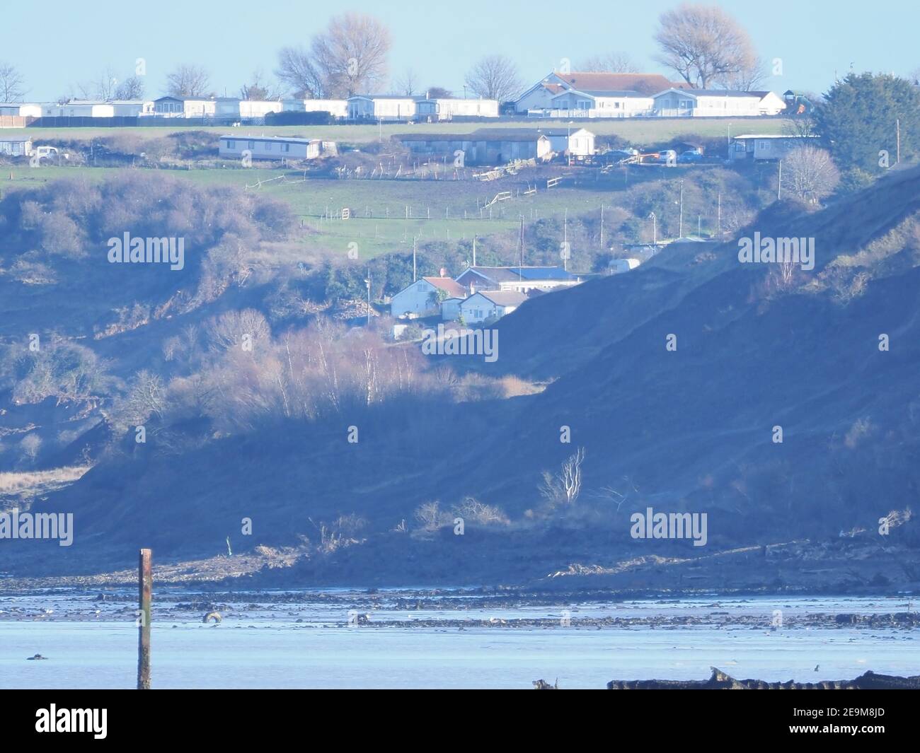 Minster on Sea, Kent, UK. 5th February, 2021. A view of the Sheppey Cliffs. Residents living on the cliff edge at Eastchurch Gap are concerned their properties are at high risk of being lost after weeks of heavy rain. An attempt by the residents to shore up the cliffs themselves with spoil was stopped by Swale Council on environmental grounds. The chairman of their action group is now calling on the Prime Minister to help them having exhausted all other avenues with the various authorities to intervene. Credit: James Bell/Alamy Live News Stock Photo