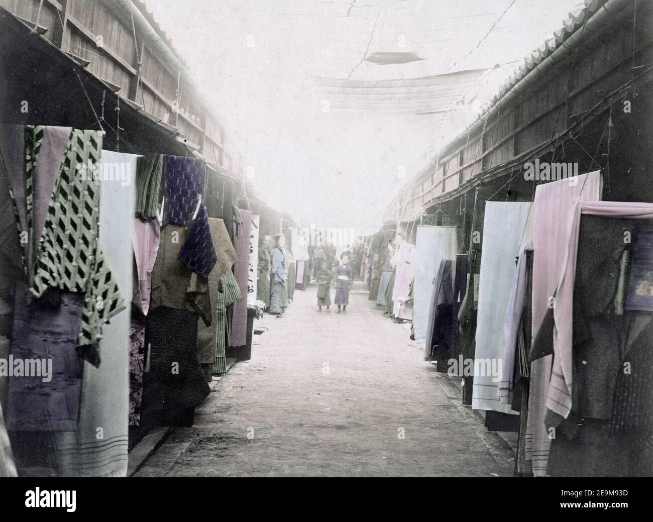 Late 19th century photograph - Street of shops selling clothes and material, Japan, c.1890 Stock Photo