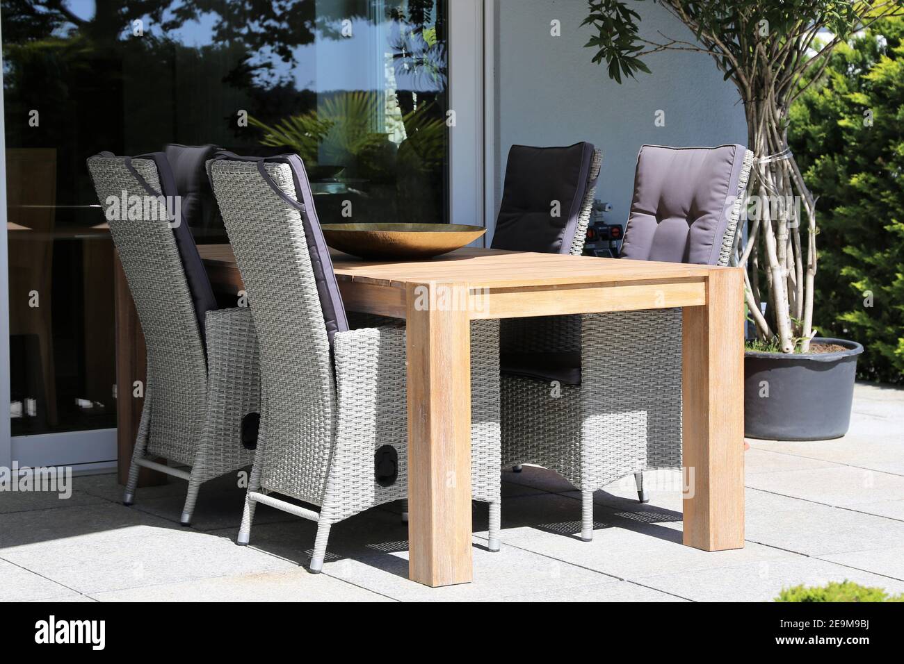 Modern garden furniture in a well kept ornamental garden Stock Photo