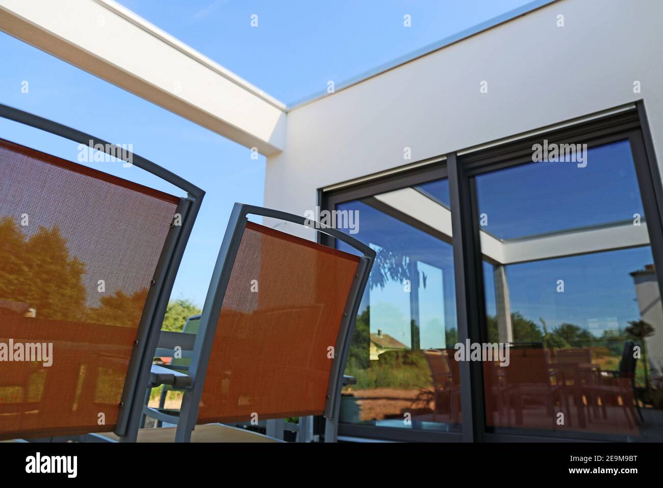 Garden terrace in mediterranean style with large sliding window Stock Photo