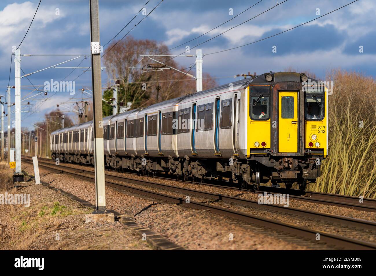 Greater Anglia Train heading to London from Cambridge. Greater Anglia Class 317 train heading for London Liverpool Street from Cambridge. Stock Photo