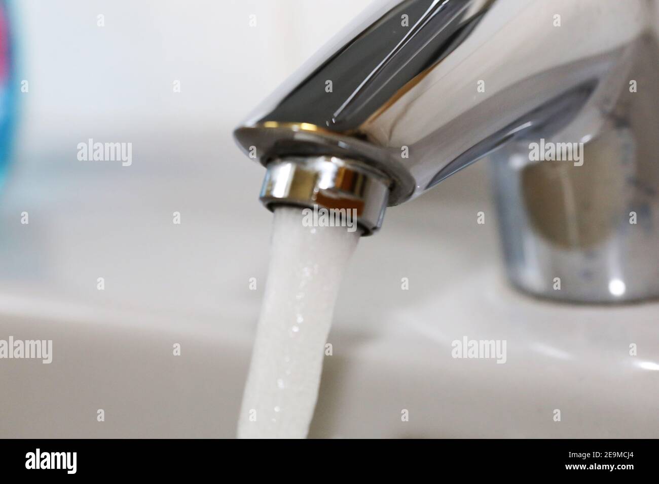 Water flowing from the tap Stock Photo - Alamy