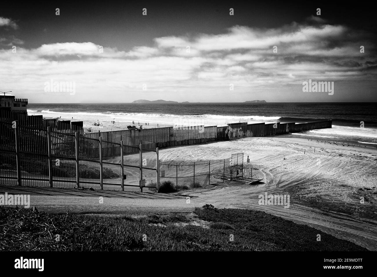 This is the border wall between USA and Mexico; that's the USA militarized side, on the other side, the beach and the restaurants of Tijuana. Stock Photo