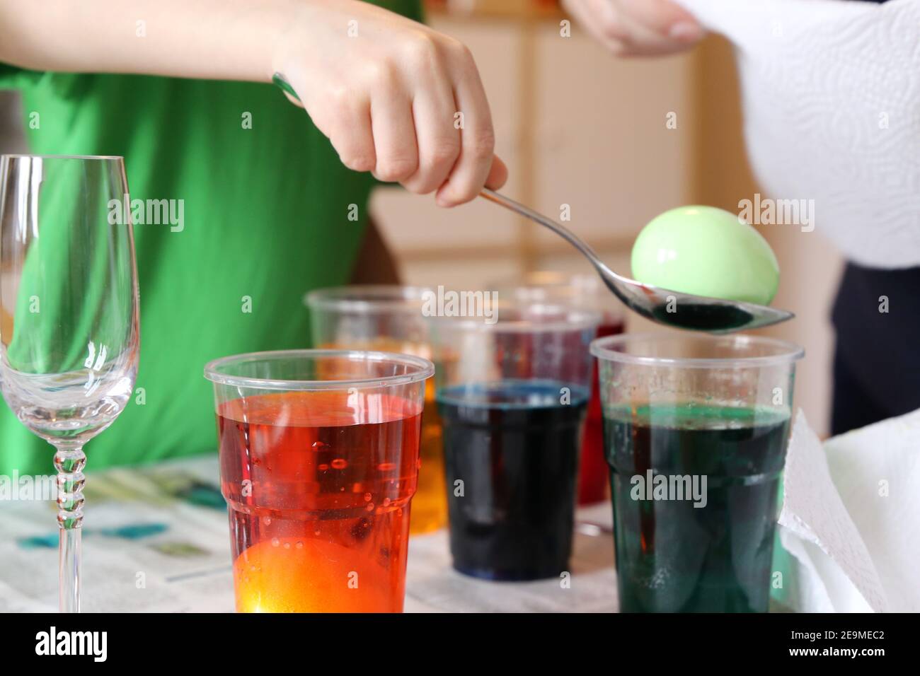 Child colouring easter eggs Stock Photo