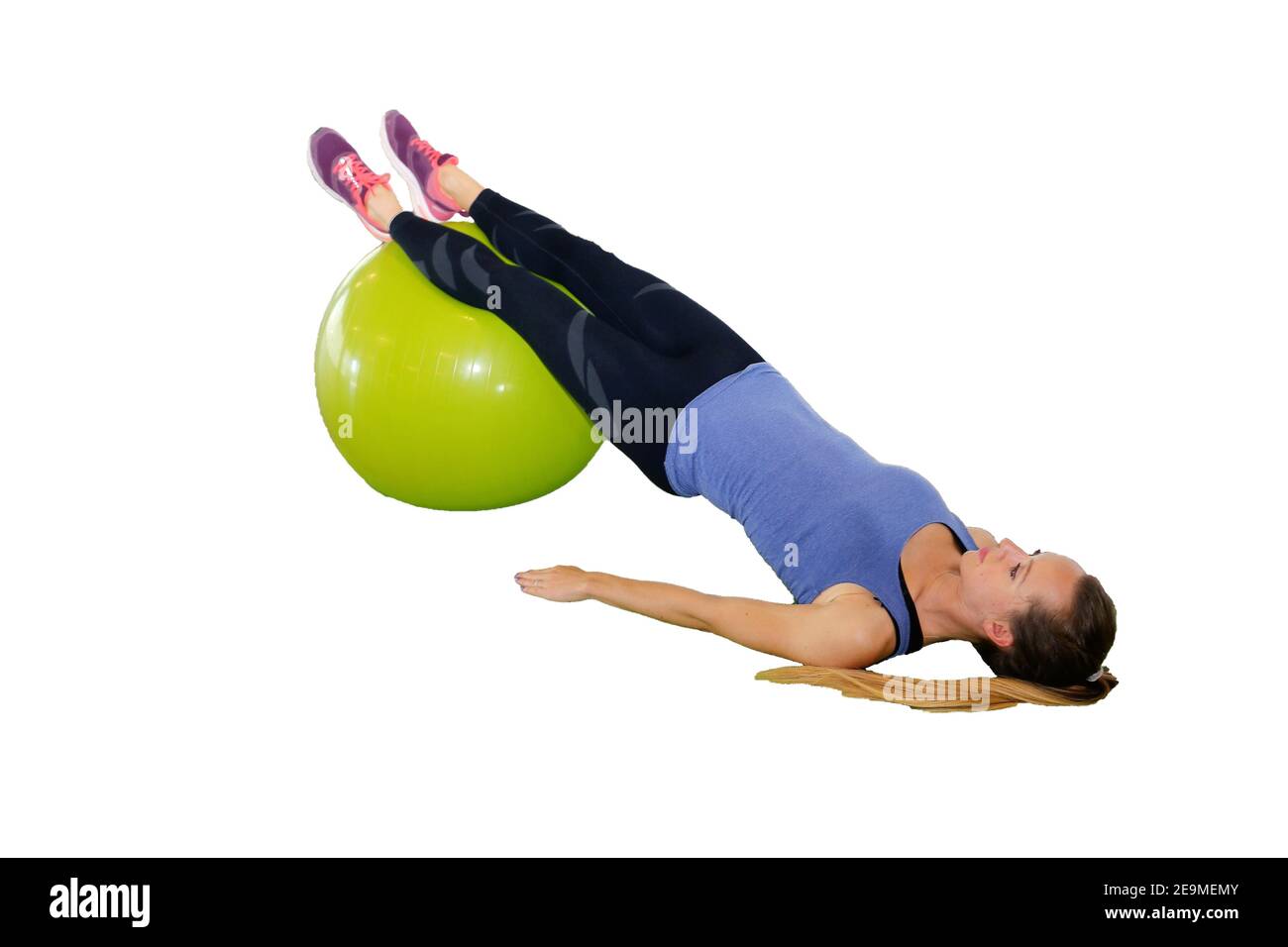 Woman doing exercises on exercise ball (white background), model released Stock Photo
