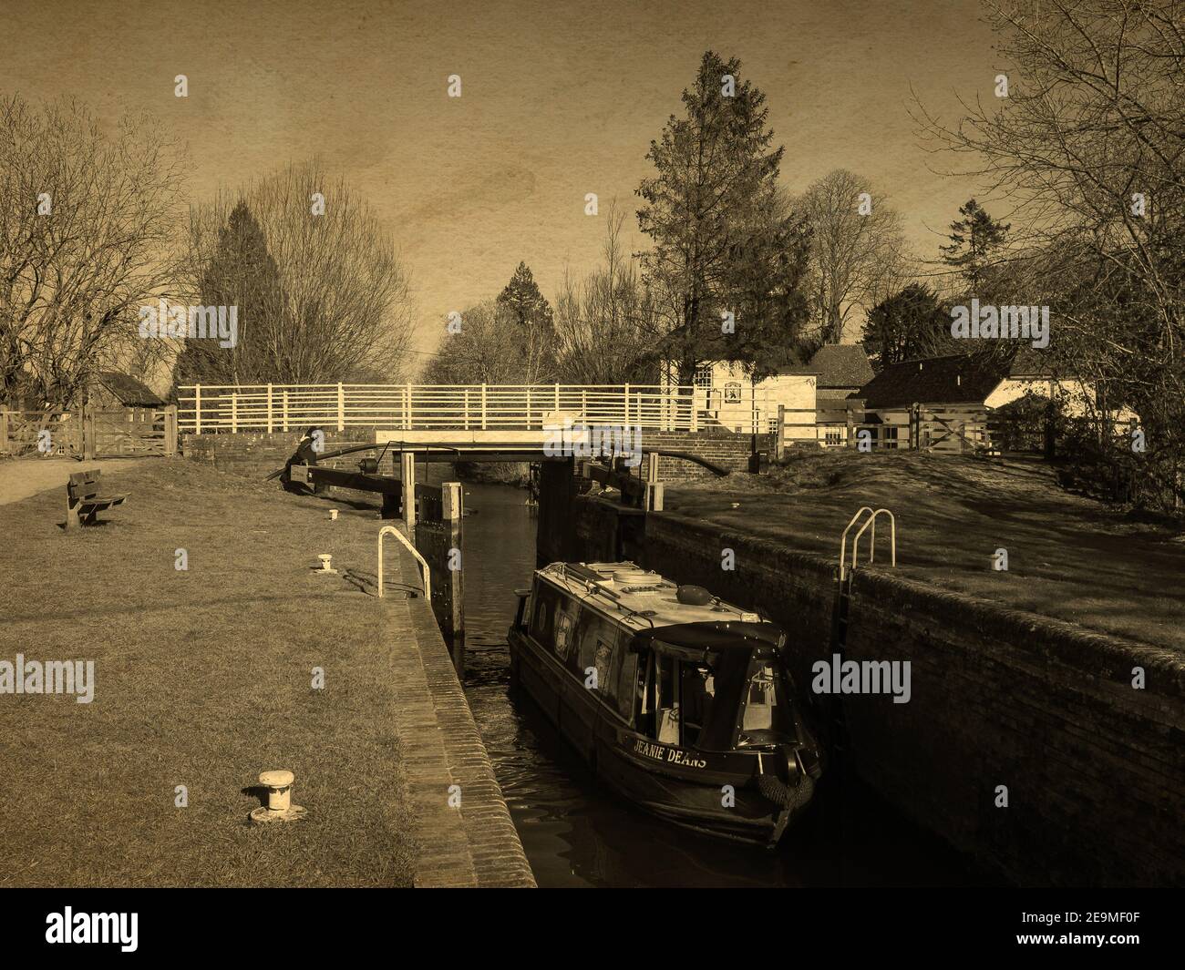 A narrowboat enters the Kintbury Lock near Hungerford in Berkshire