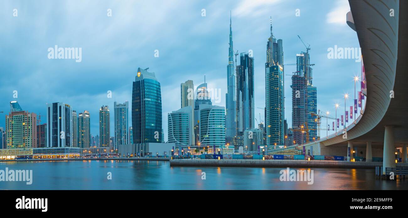 DUBAI, UAE - MARCH 24, 2017: The evening skyline over the Canal and Downtown. Stock Photo