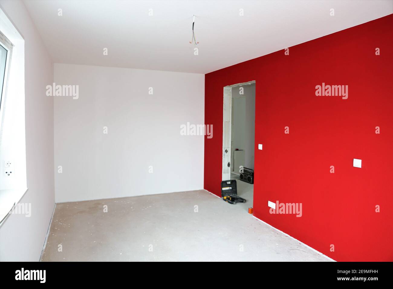 Newly renovated interior with modern red and white wall colors Stock