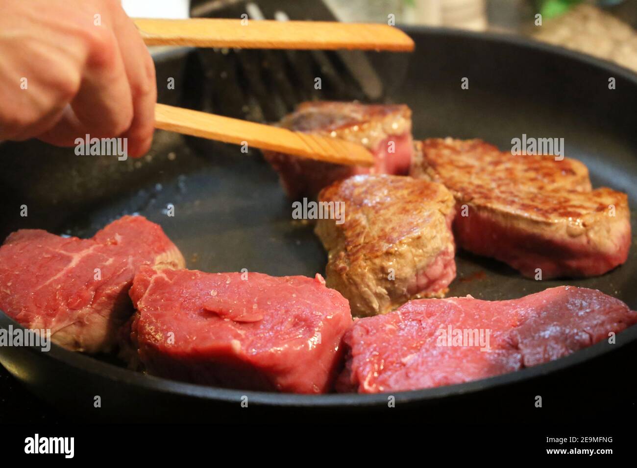 Beef fillet (beef tenderloin) grilling in the frying pan Stock Photo