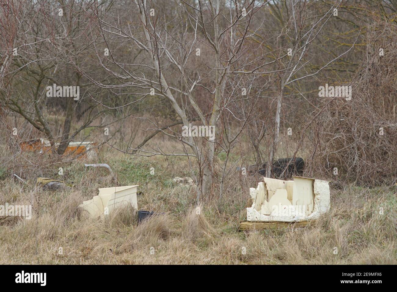 Bakonykoppany, Hungary - Febr 03, 2021: An illegal garbage dump in the nature at the side of Bakonykoppany Village in Hungary. Plastic and other waste Stock Photo