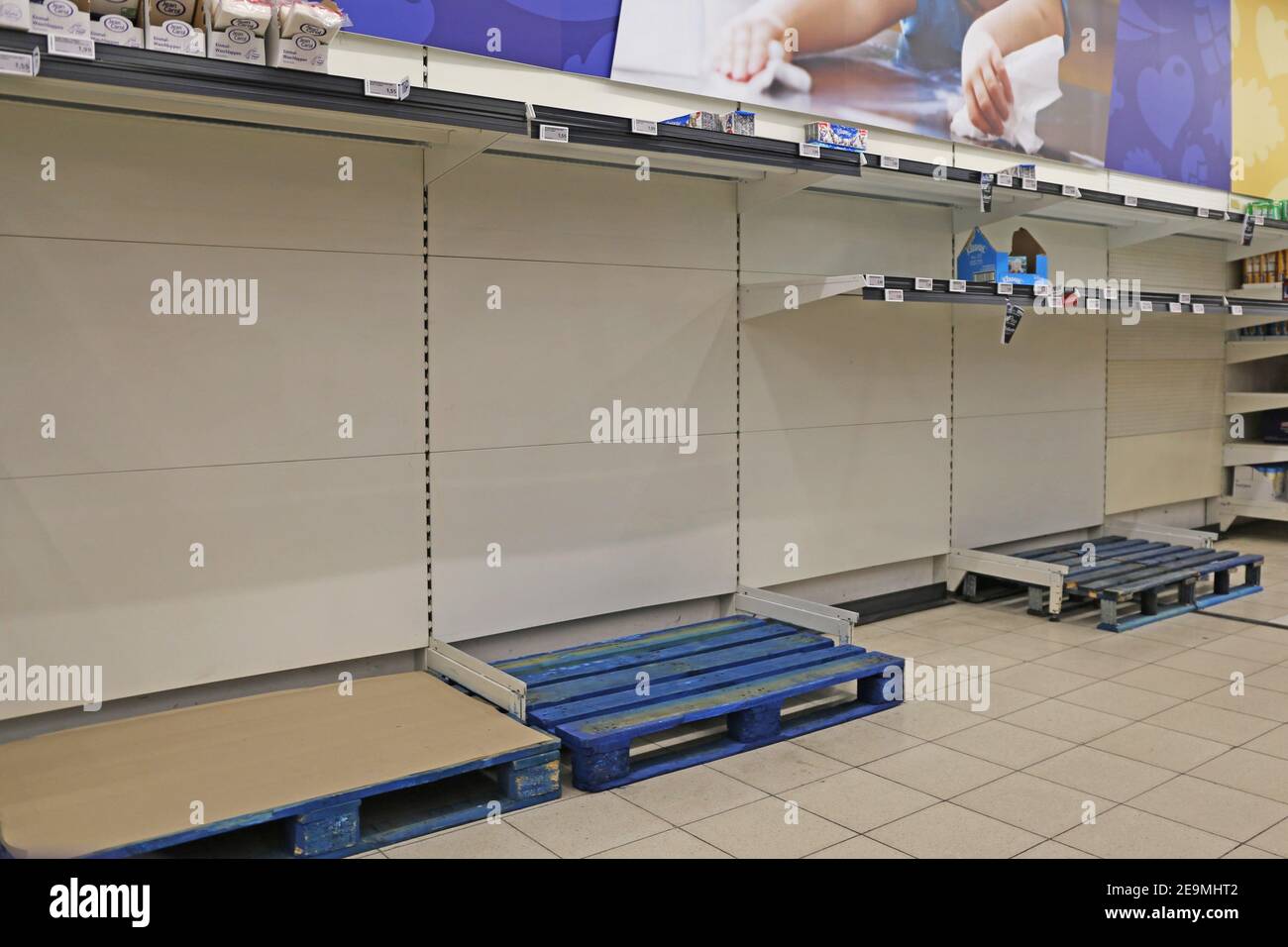 Empty shelf with sold out hygiene articles in a supermarket in Germany(Mannheim, Germany, March 14, 2020) Stock Photo