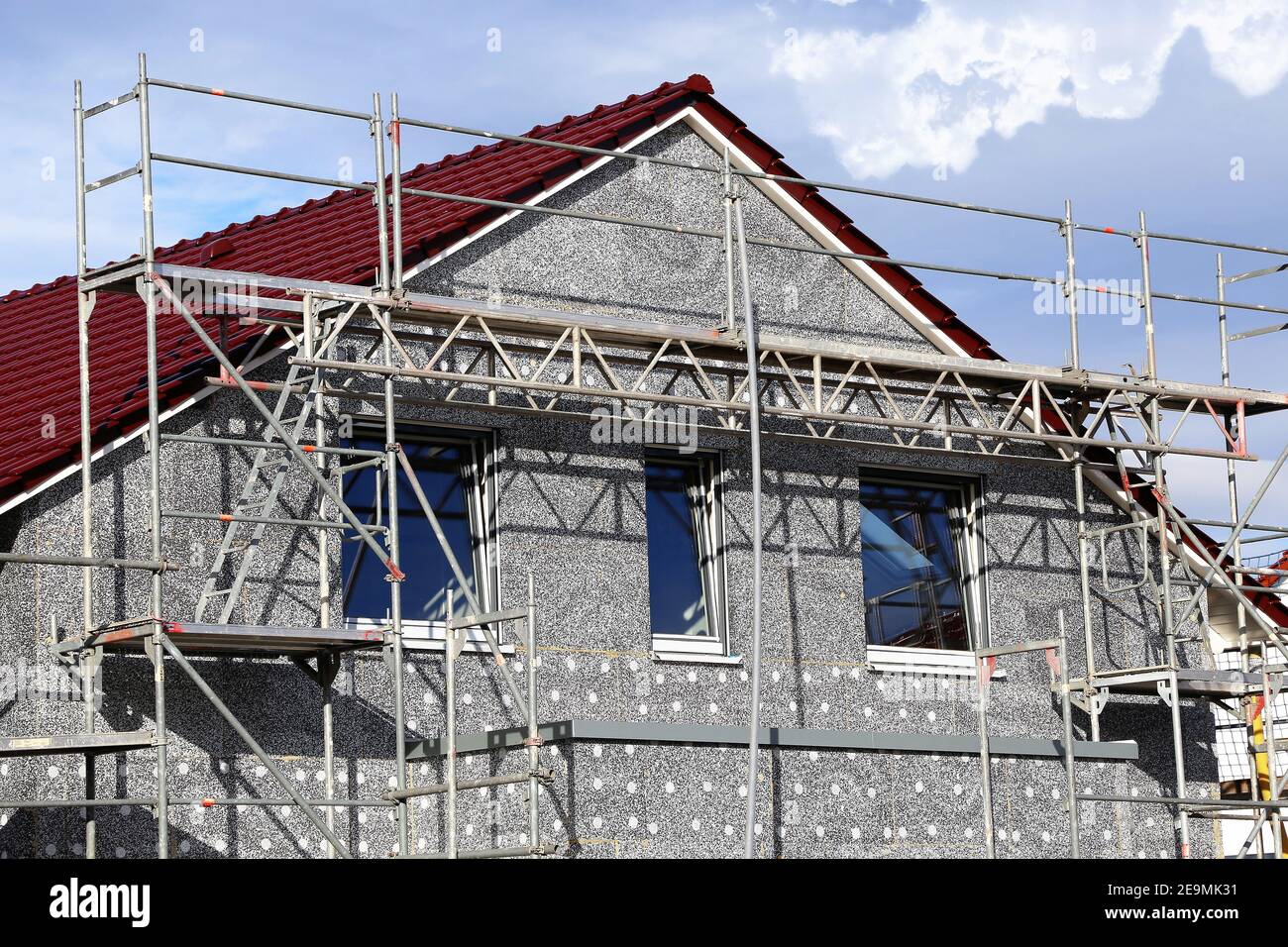 Installation of thermal insulation to a house facade Stock Photo - Alamy