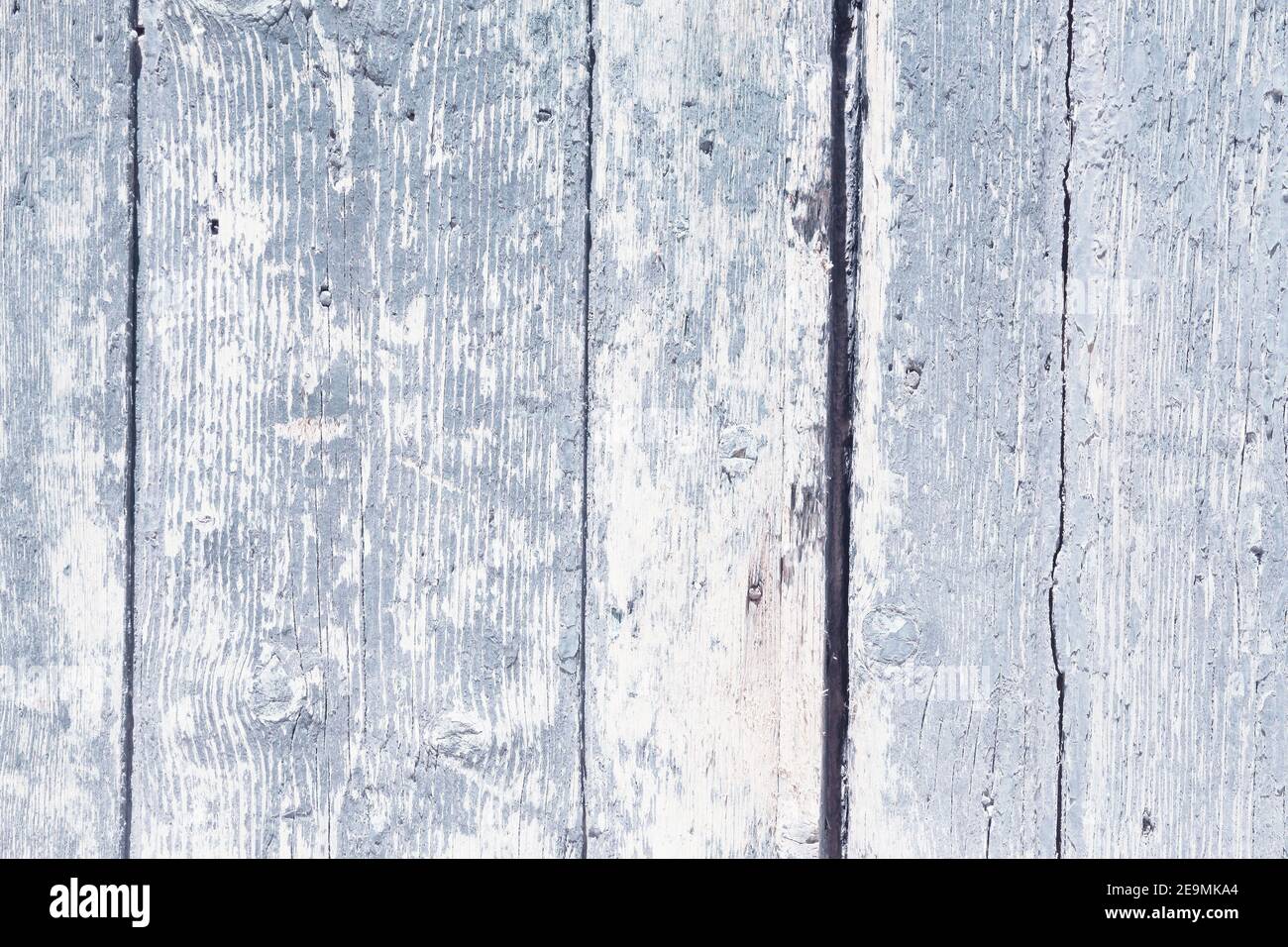 Bright distressed wood texture. White distressed wooden door boards