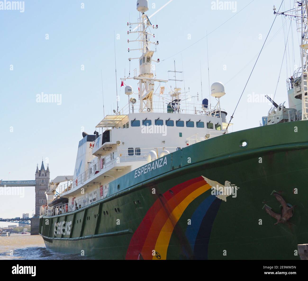 the Greenpeace ship Esperanza docked on the river Thames in London with Tower Bridge in the background, April 2019 Stock Photo