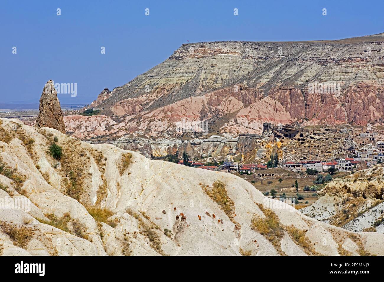 The town / village Göreme among the fairy chimney rock formations in Cappadocia, Nevşehir Province in Central Anatolia, Turkey Stock Photo