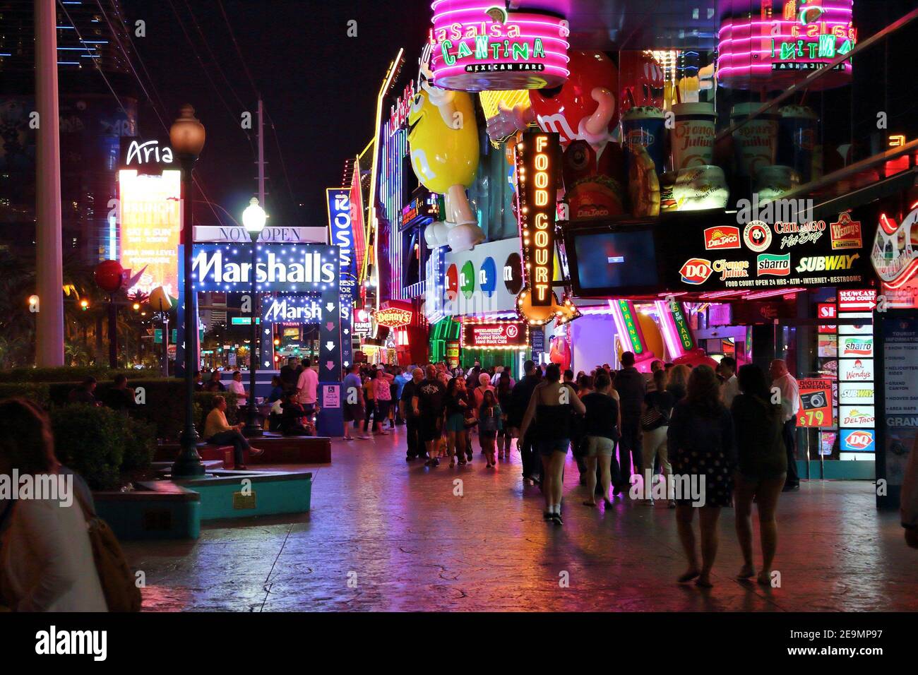 LAS VEGAS, USA - APRIL 13, 2014: People visit the famous Strip in Las Vegas. 15 of 25 largest hotels in the world are located at the strip with more t Stock Photo