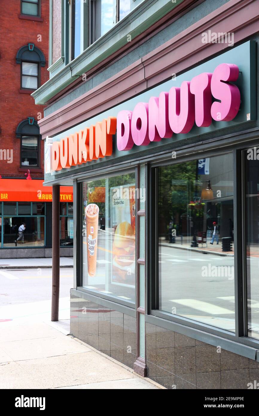 PROVIDENCE, USA - JUNE 8, 2013: Exterior of Dunkin Donuts shop in Providence. The company is the largest coffee and baked goods franchise in the world Stock Photo