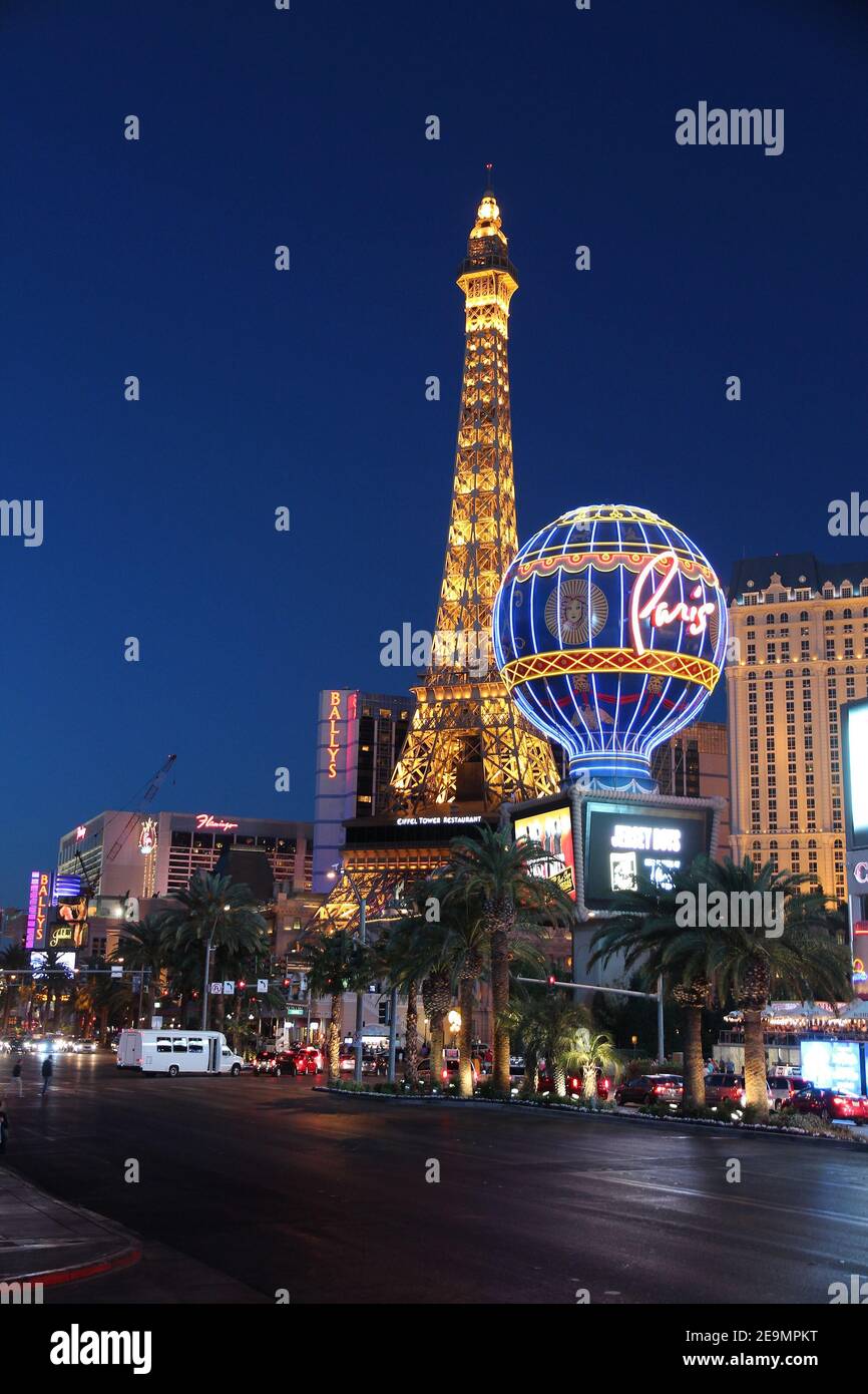 LAS VEGAS, USA - APRIL 14, 2014: People visit the famous Strip in Las Vegas. 15 of 25 largest hotels in the world are located at the strip with more t Stock Photo