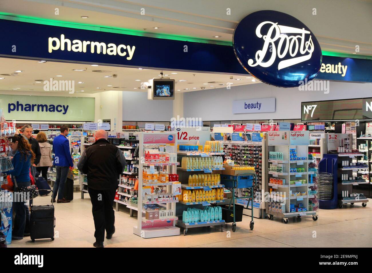 LONDON, UK - APRIL 16, 2014: People visit Boots at London Heathrow Airport. is a pharmaceutical retailer brand with 2,500 shops in Stock Photo - Alamy