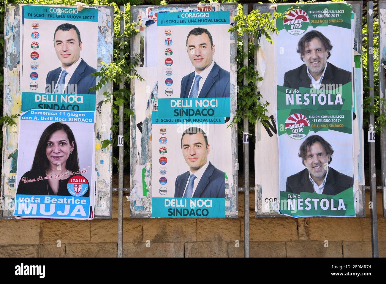 LECCE, ITALY - JUNE 1, 2017: Political candidates posters in Lecce, Italy. Lecce had its municipal elections in June 2017. Stock Photo