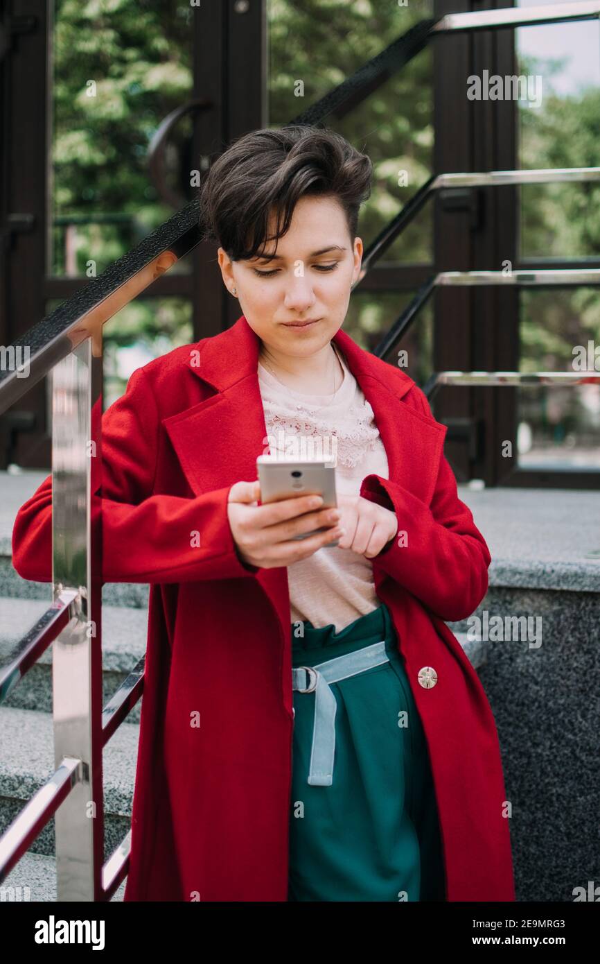 Gen z, social media, influencer, technology, youth millennial people  concept. Young brunette girl with short hair using mobile phone outdoor  Stock Photo - Alamy