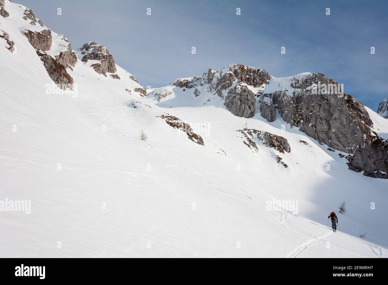 climbing up to Antander Fork. Ski touring in Alpago mountain range. January 2009. Stock Photo