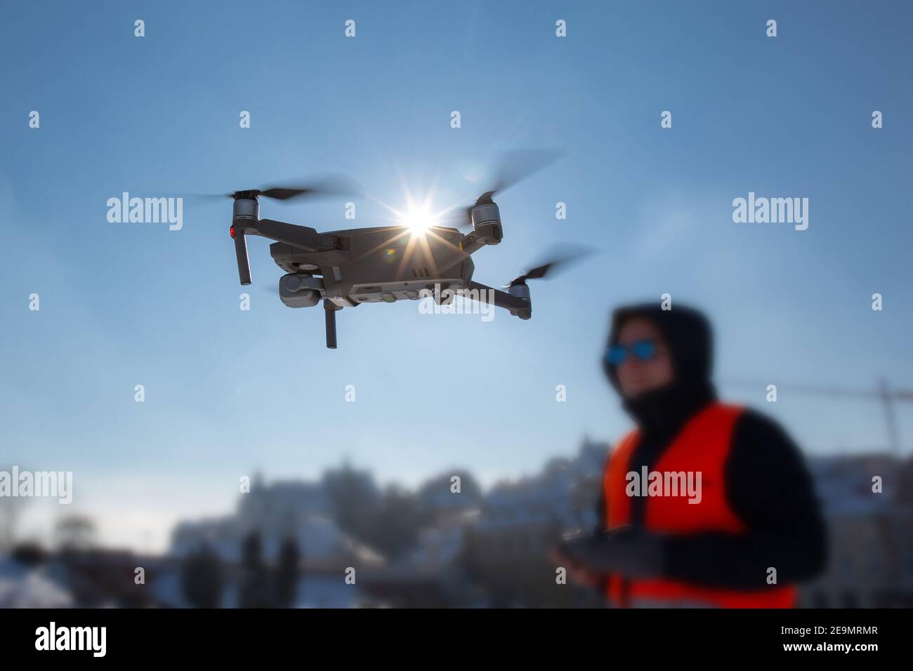 Drone flying in the blue sky. drone pilot, UAV , Multirotor, Photography, Helicopter , Drone, Unmanned copter flight, pilot flying dron Stock Photo