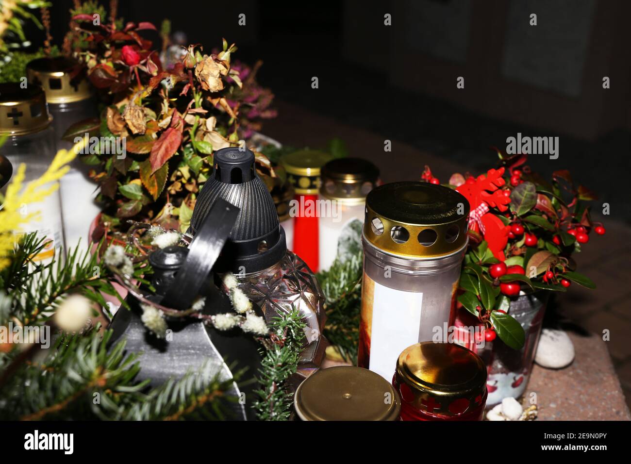 Lighting candles for the dead on All Saints Day Stock Photo Alamy