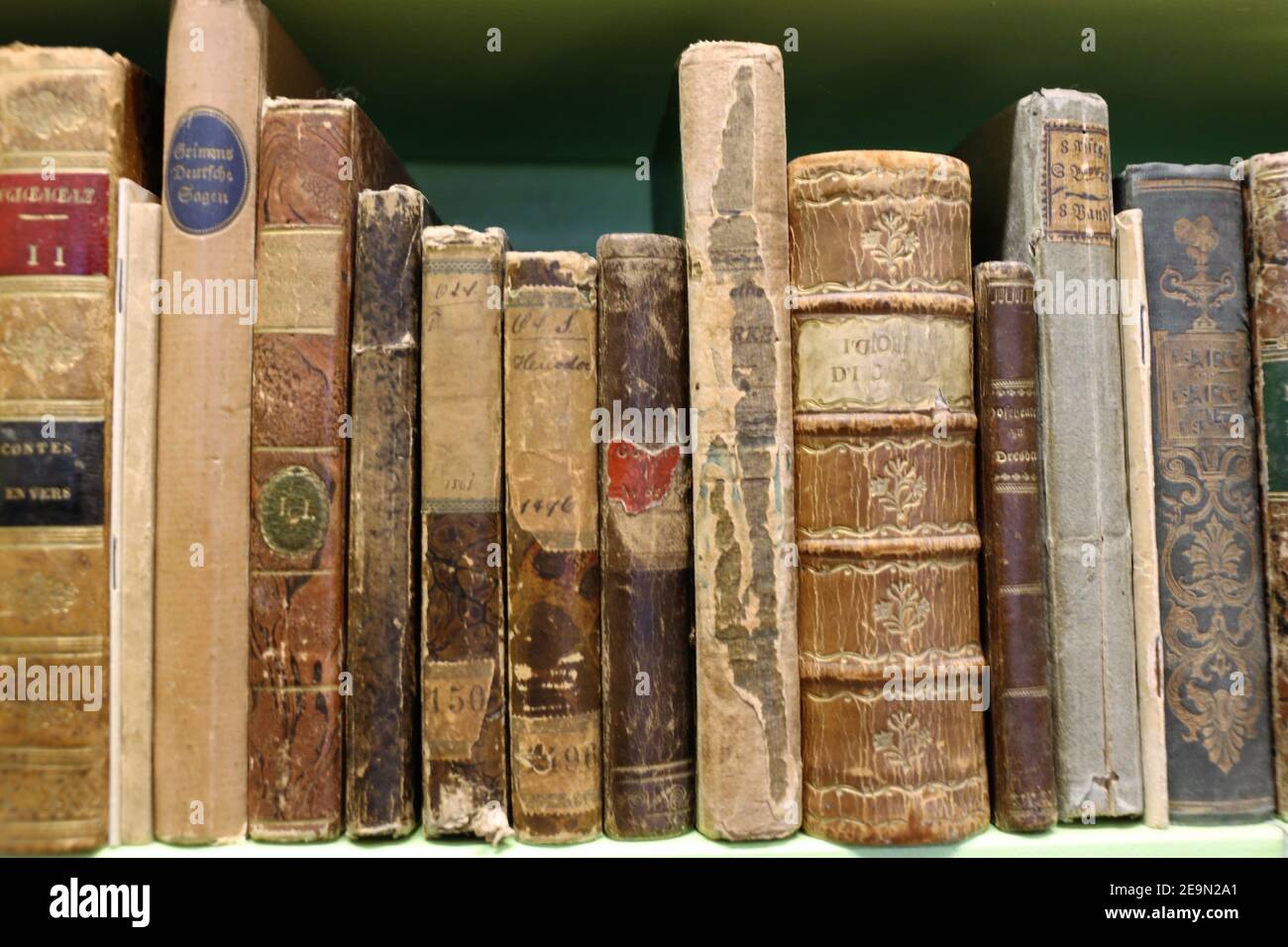 Books on a shelf in an antique shop Stock Photo - Alamy