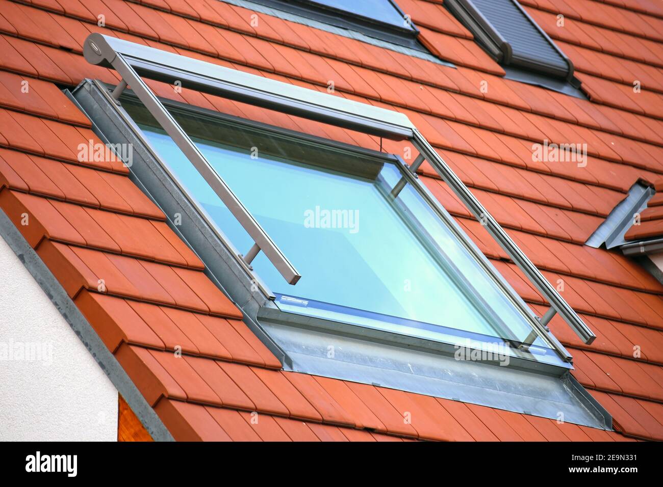 Skylight on a new tiled roof Stock Photo Alamy