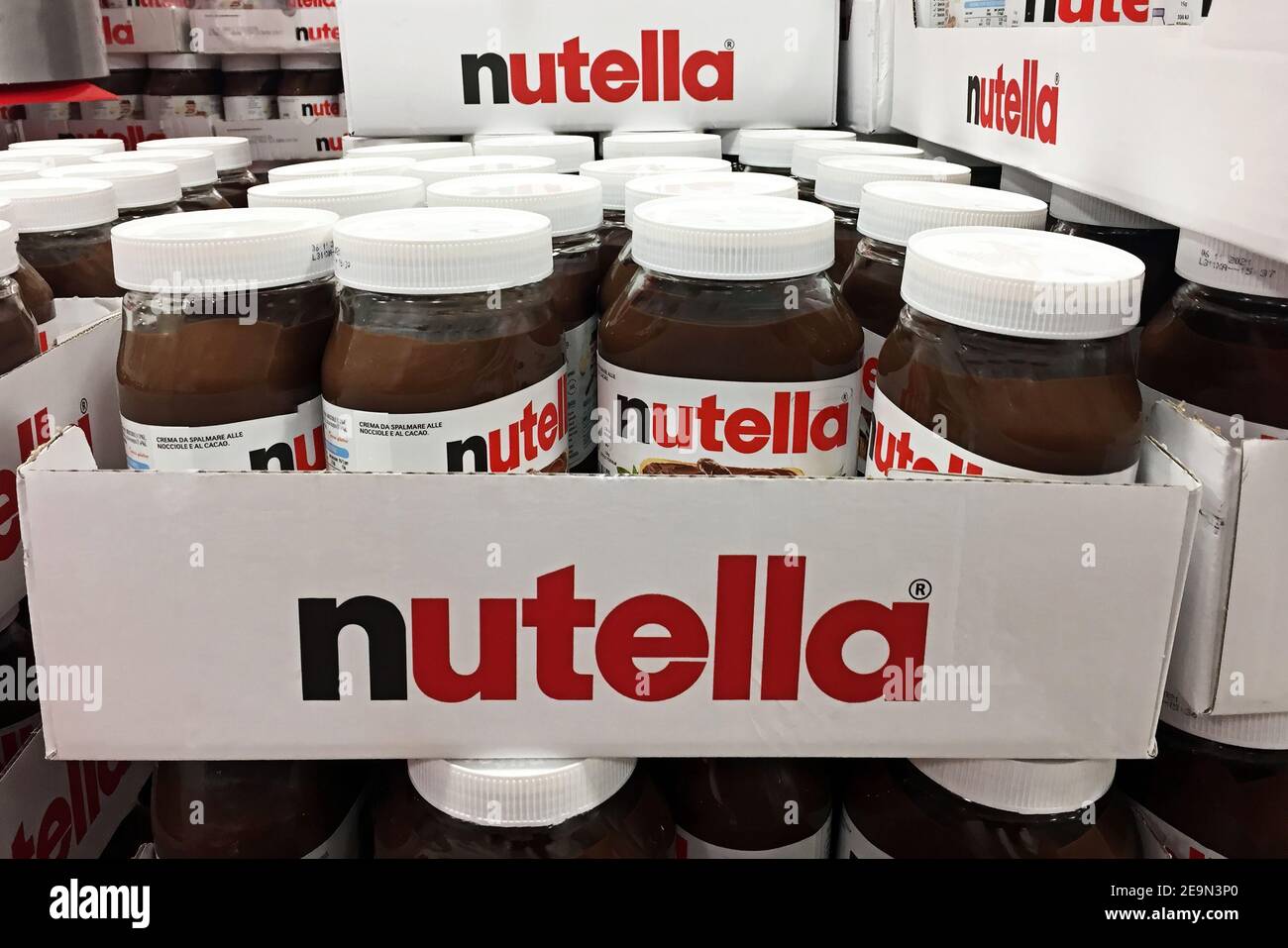 Nutella hazelnut spread jars in shelf of an italian supermarket