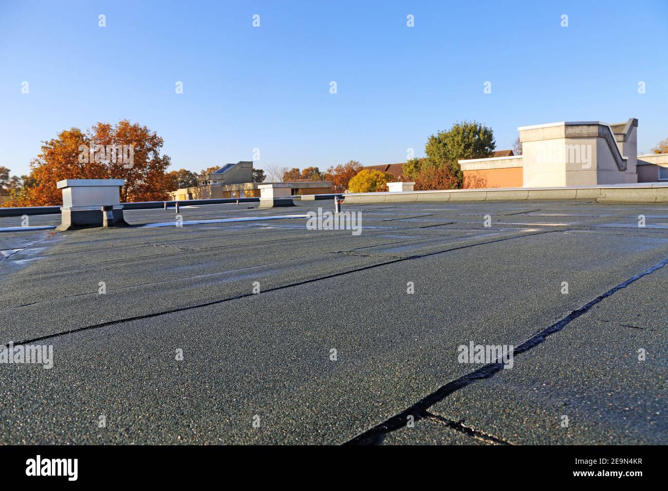 Building with newly renovated flat roof sealing Stock Photo Alamy