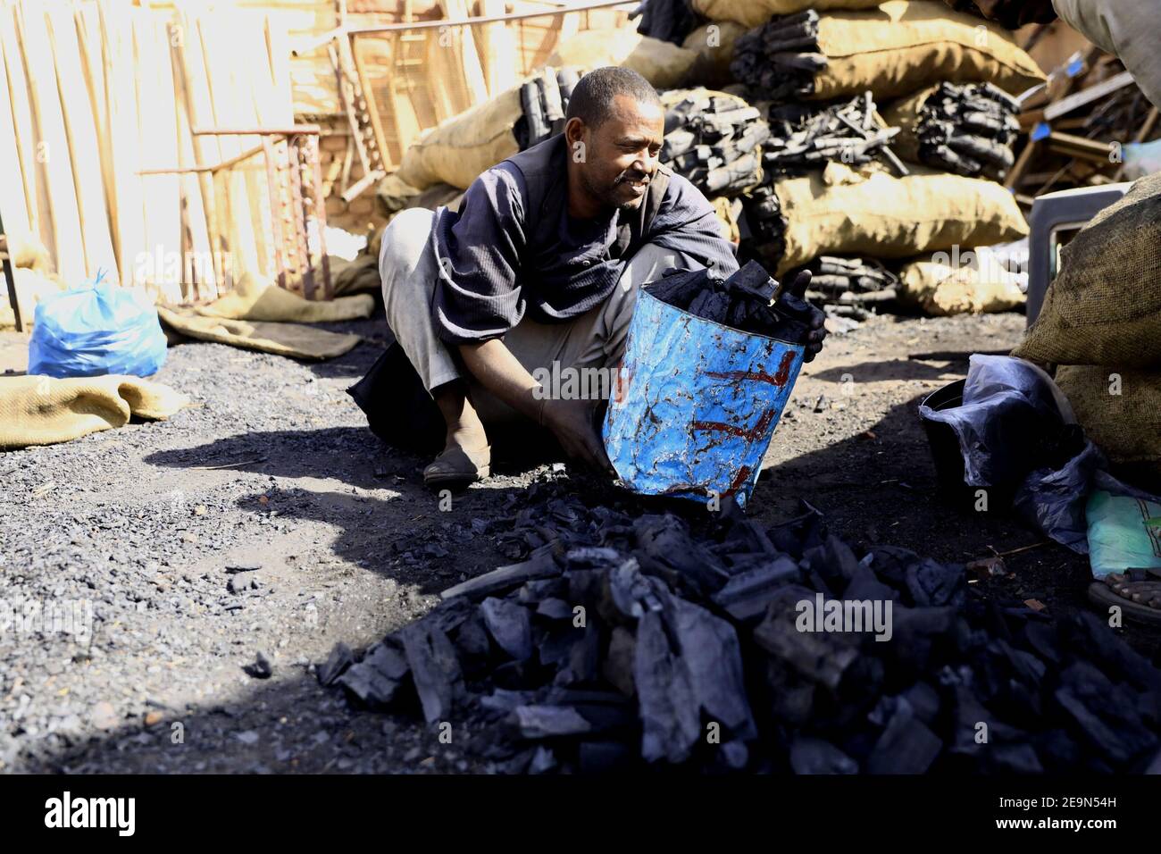 Khartoum, Sudan. 5th Feb, 2021. A man buys charcoal amid a cooking gas