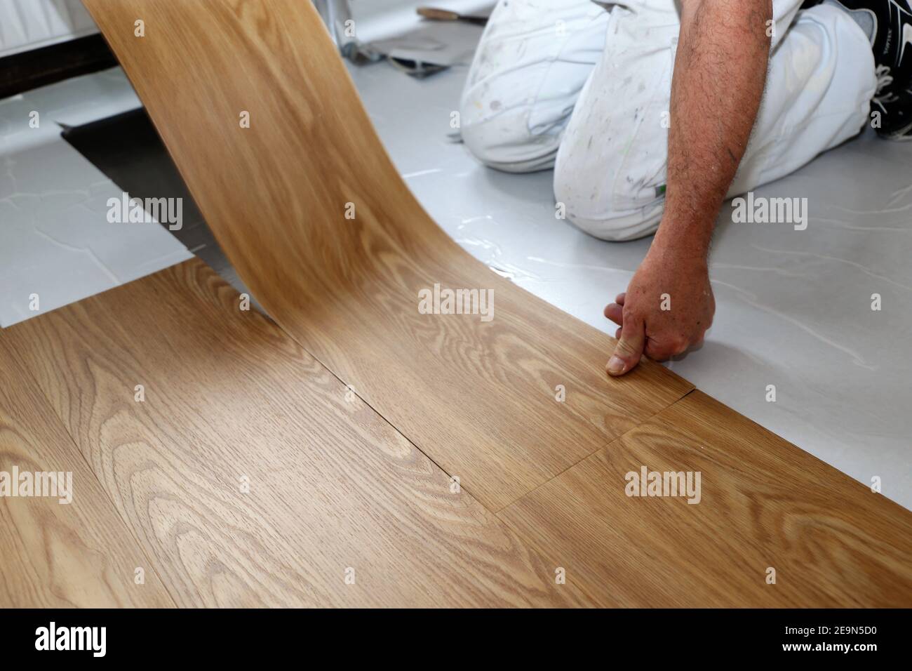 Professional installation of vinyl flooring or pvc flooring Stock Photo