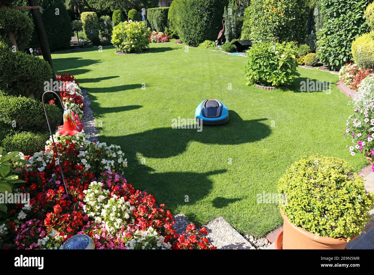 Neat and tidy garden with turf and flowers Stock Photo Alamy