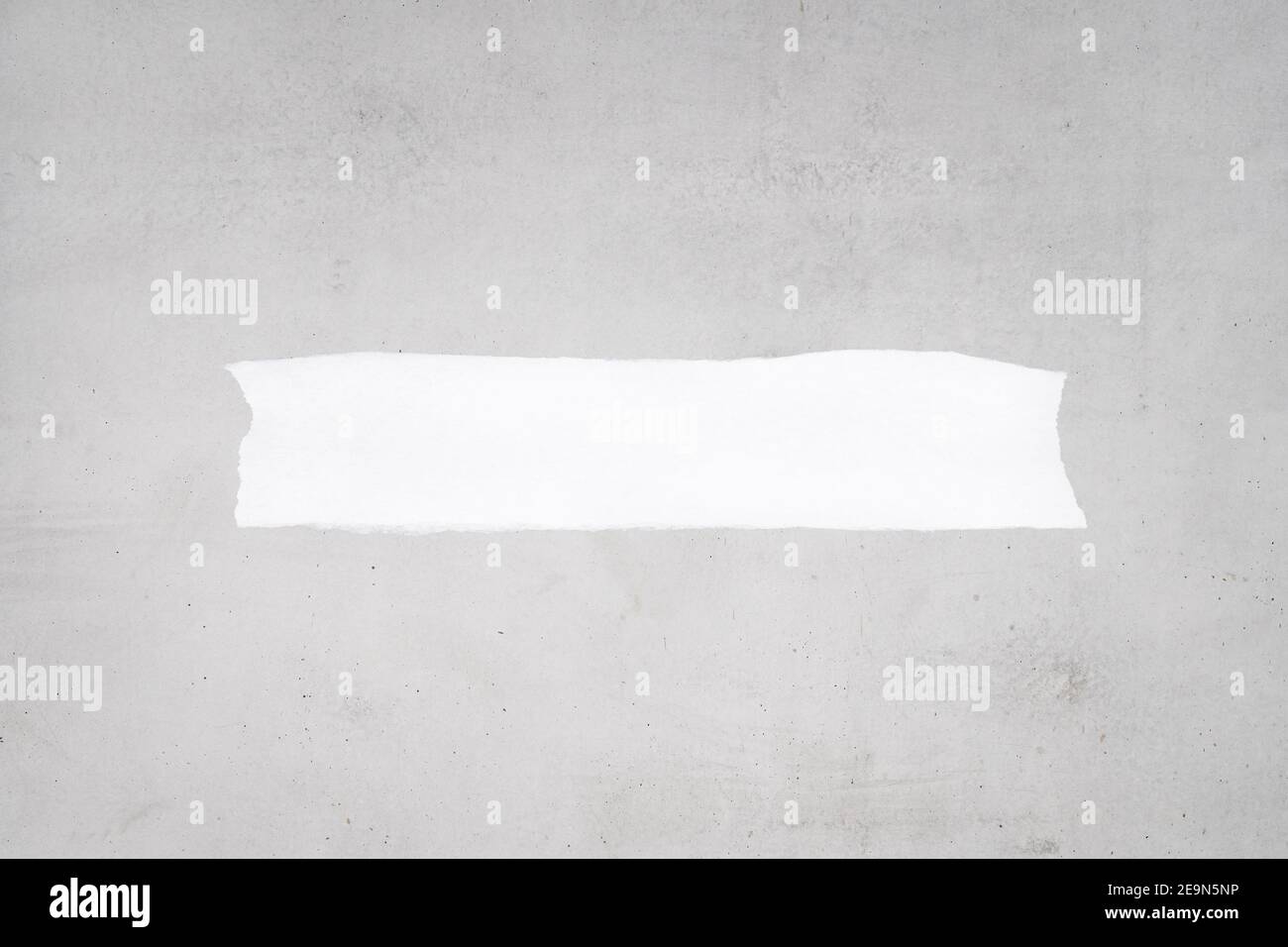Blank Ripped white paper on gray concrete background to add text. Mock up. Template Stock Photo