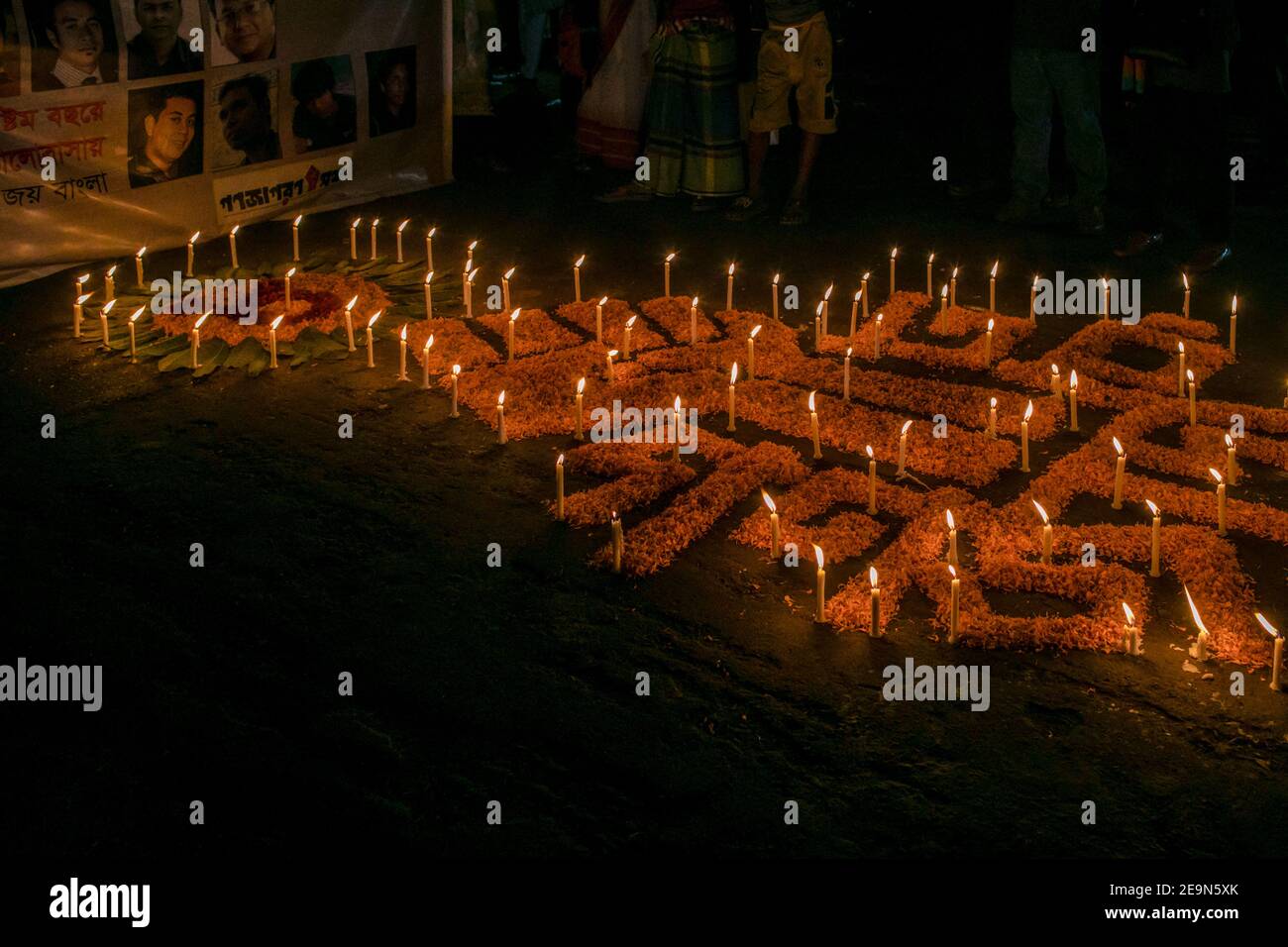 Burning candles during the vigil. Bangladeshi activities in a