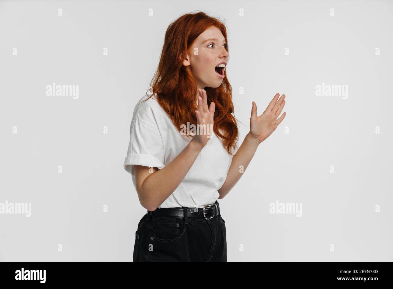 Ginger beautiful shocked girl expressing surprise isolated over white ...