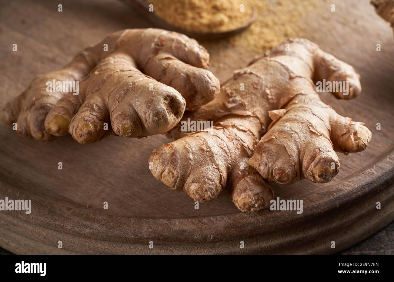 Ginger root on a wooden cutting board Stock Photo