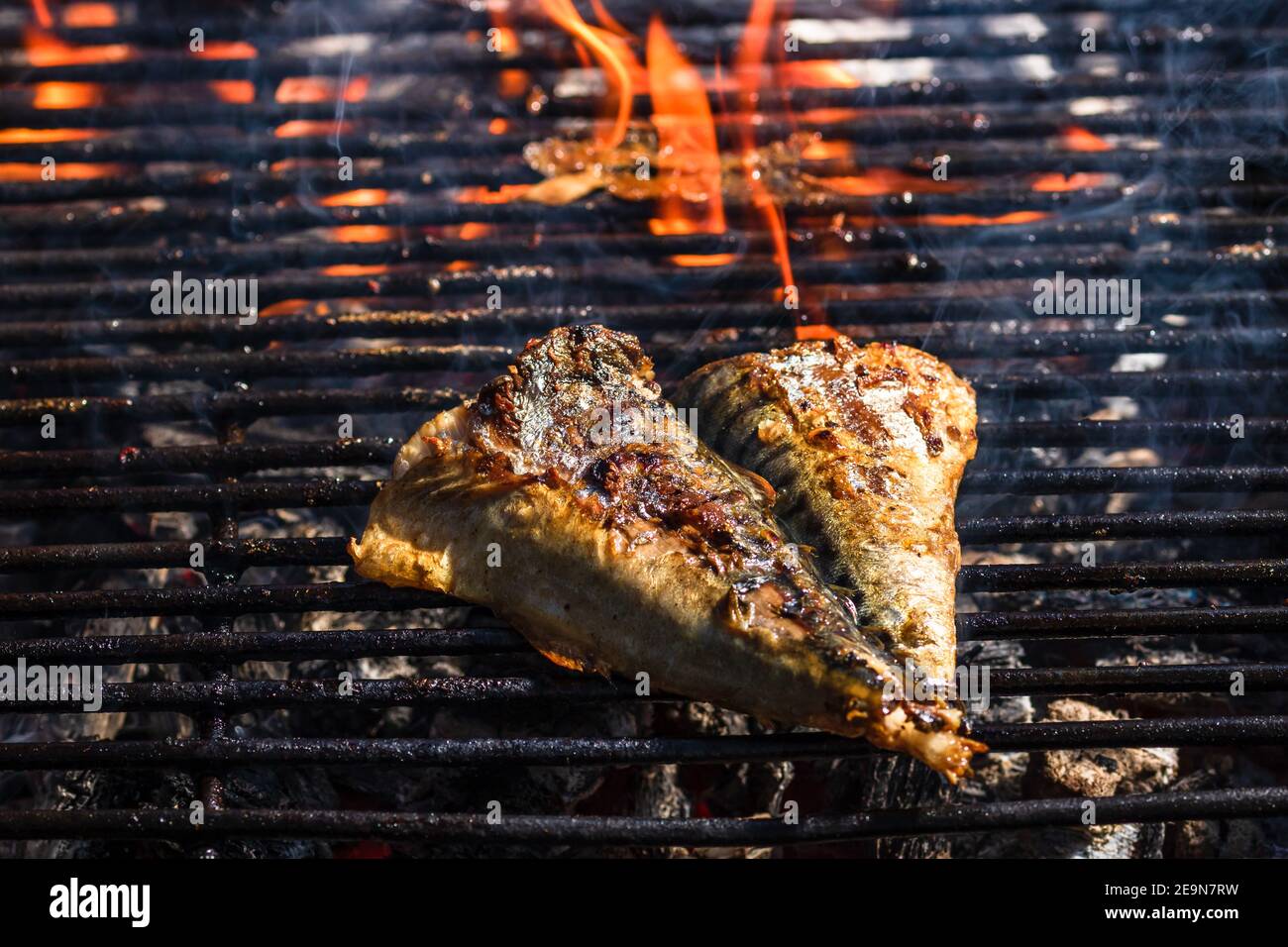 Grilled mackerel fish with smoke on a charcoal barbecue grill Stock Photo Alamy