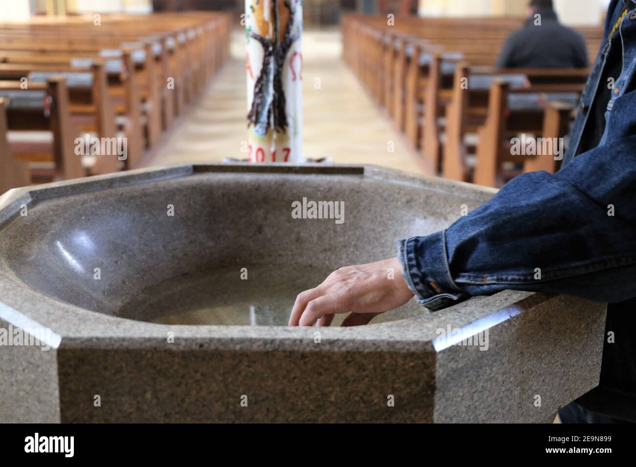 Symbol image: Hand in holy water Stock Photo