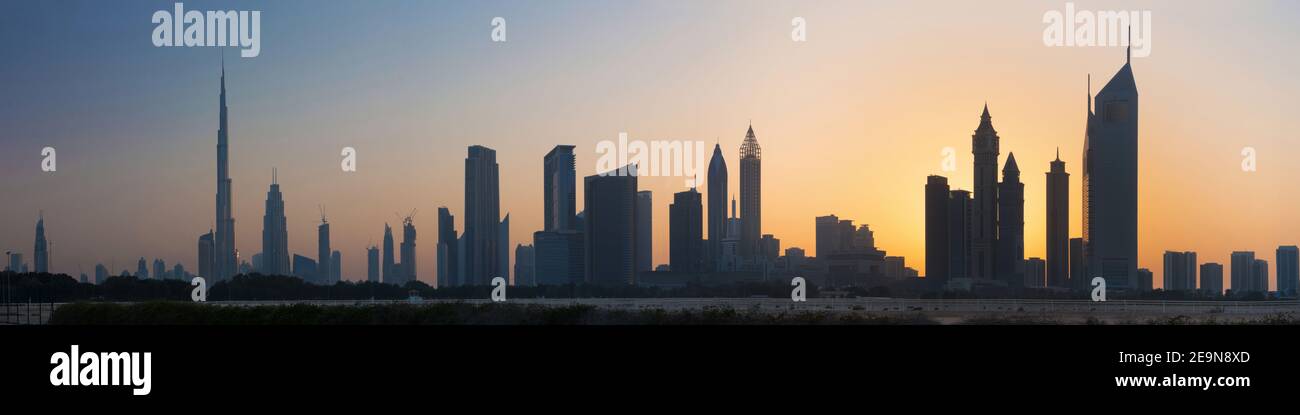 Dubai - The evening silhouette and skyline of Downtown. Stock Photo