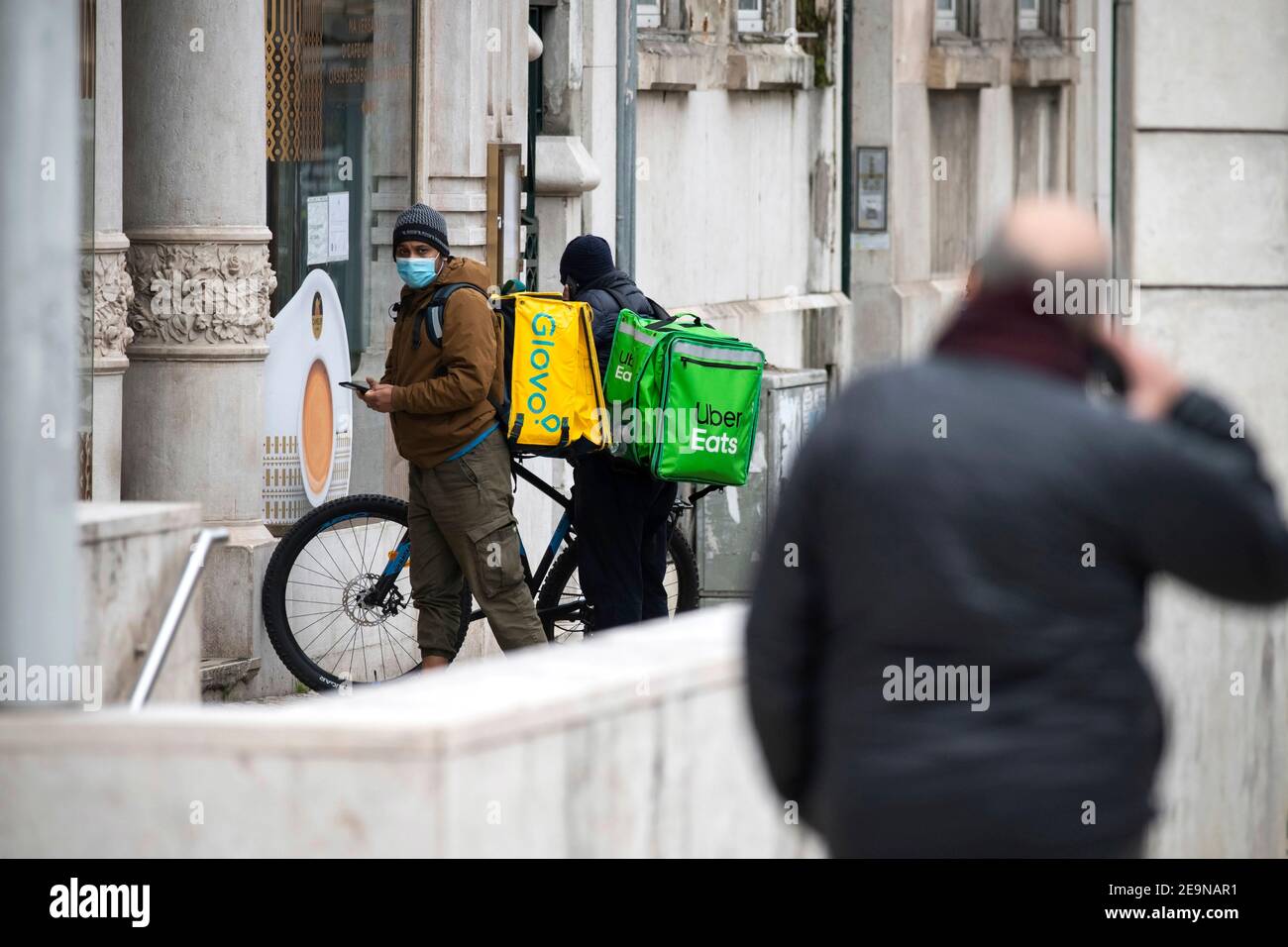 Lisbon, Portugal. 5th Feb, 2021. Uber Eats and Glovo couriers seen 