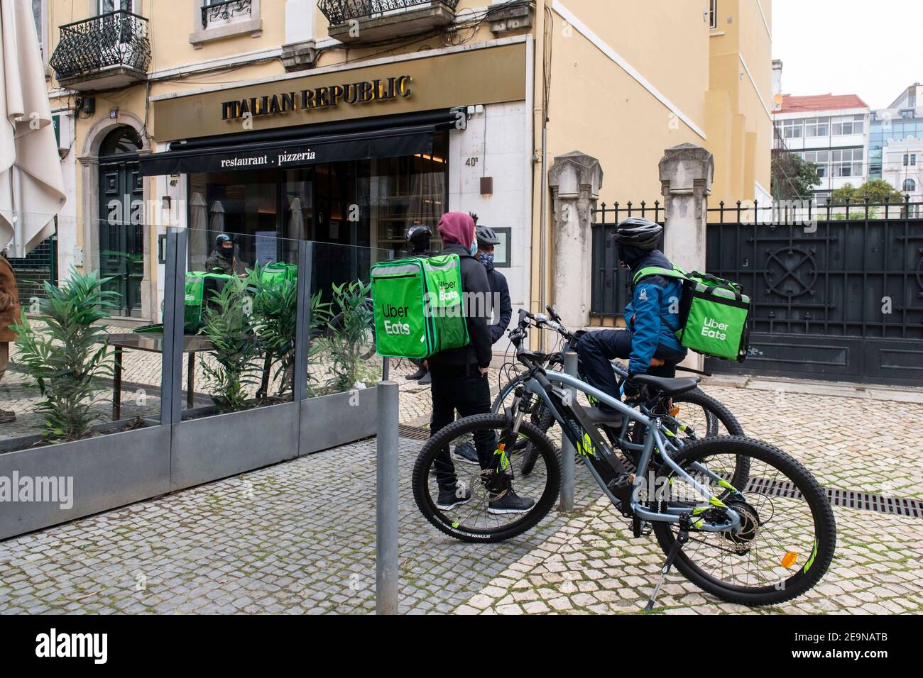 Lisbon, Portugal. 5th Feb, 2021. Uber Eats couriers seen waiting 