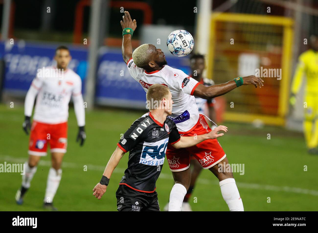 Kortrijk's Ante Palaversa and Mouscron's Jean Onana fight for the ball during a soccer match between Royal Excel Mouscron and KV Kortrijk, Friday 05 F Stock Photo