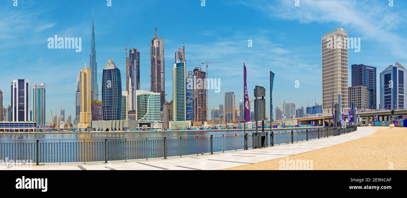DUBAI, UAE - MARCH 29, 2017: The skyline over the new Canal and Downtown and the promenade. Stock Photo