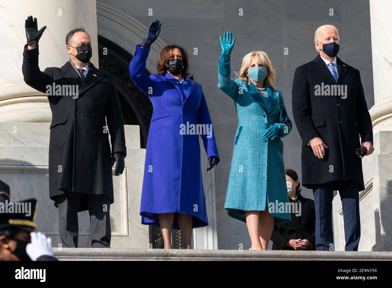 U.S President elect Joe Biden and Vice President elect Kamala Harris wave from the capitol steps as they arrive for Inauguration Day January 20, 2021 in Washington, DC. Standing from left to right are: Doug Emhoff, Vice President-elect Kamala Harris, Dr. Jill Biden and President-elect Joe Biden. Stock Photo