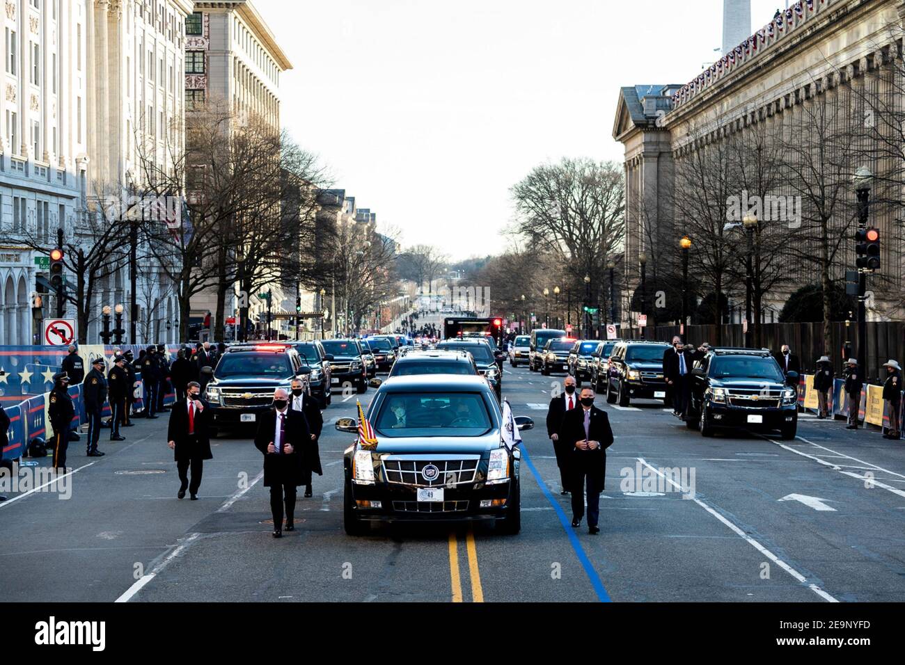 The motorcade carrying U.S President Joe Biden and First Lady Dr Jill Biden makes way up 15th Street toward Pennsylvania Avenue during the Inauguration Day parade January 20, 2021 in Washington, DC. Stock Photo